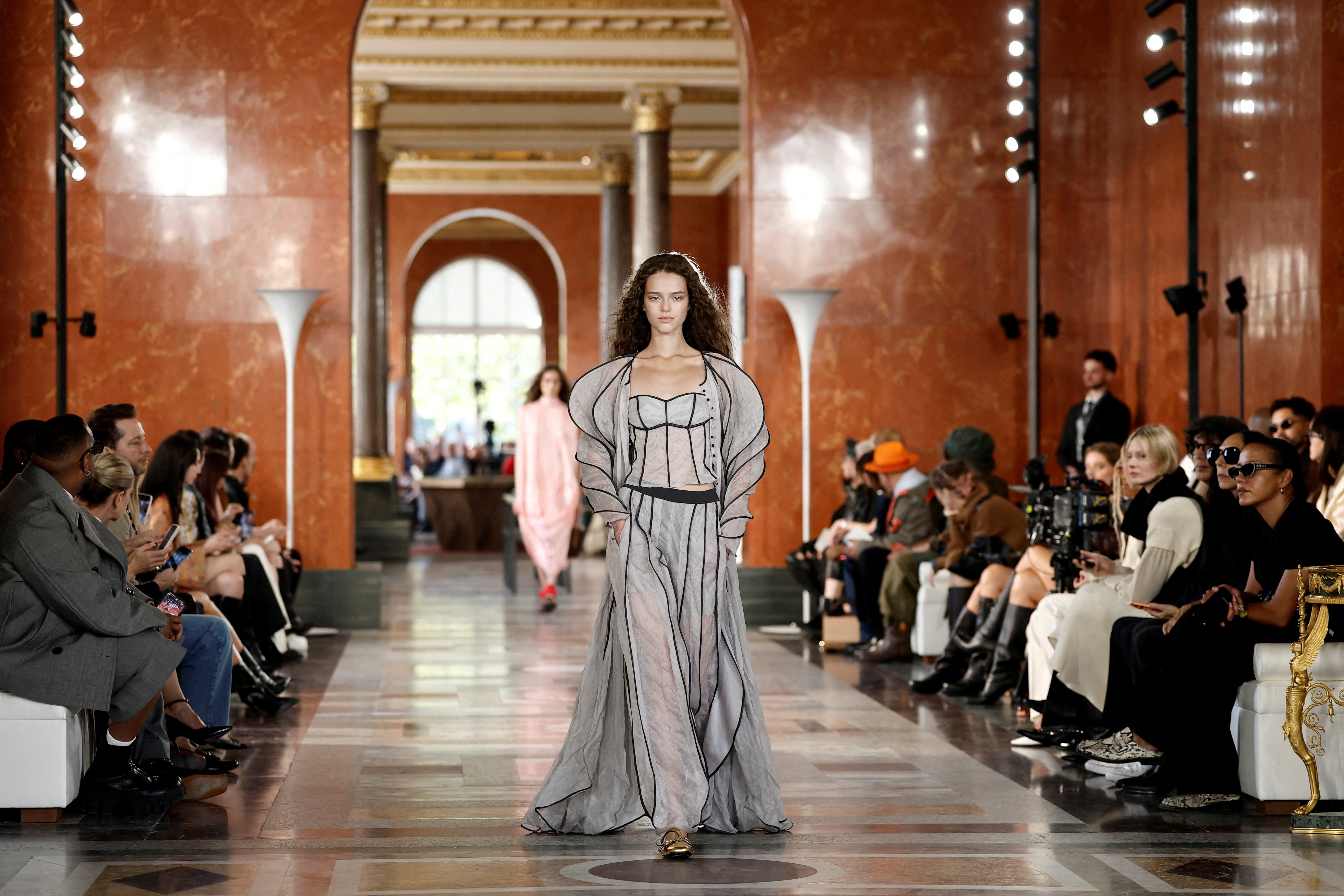 A model presents a creation by designer Nicolas Ghesquiere as part of his Spring/Summer 2026 Women's ready-to-wear collection show for the fashion house Louis Vuitton during Paris Fashion Week in Paris, France, September 30, 2025. (Reuters)